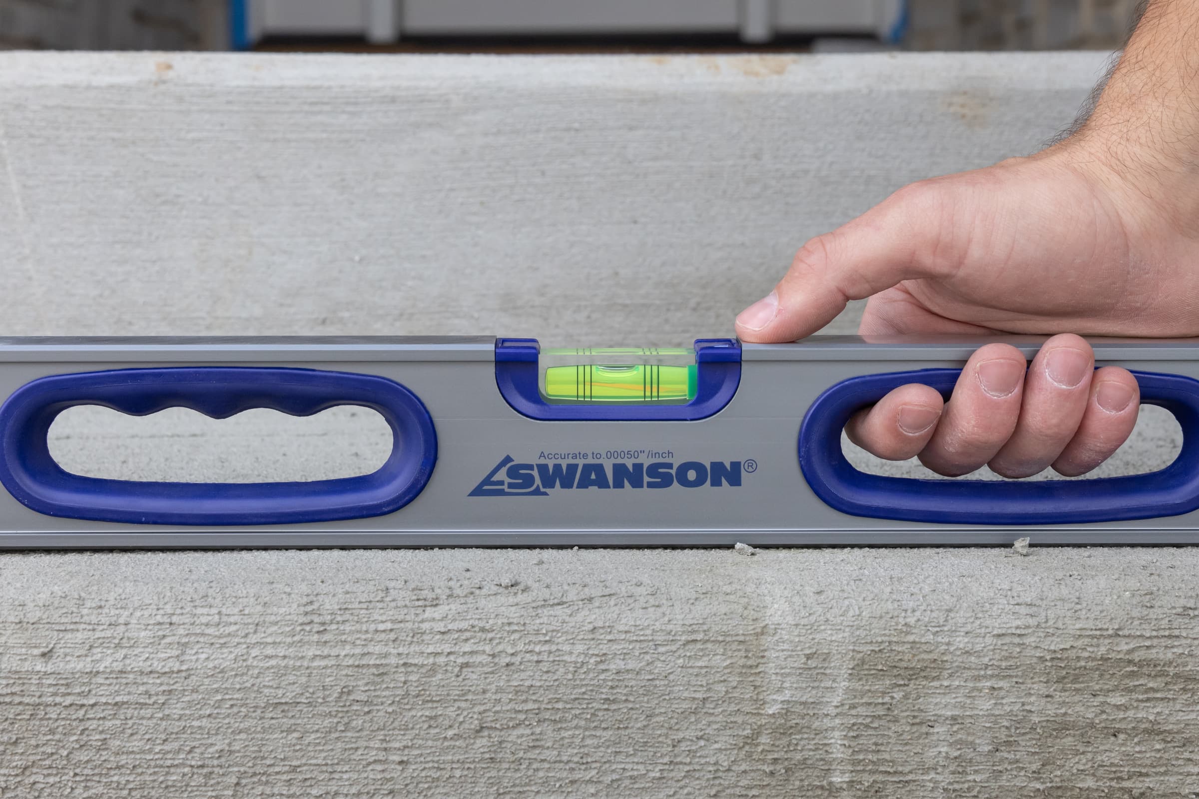 A trades pro using the Swanson IBX240 I-Box™ Level on a job site.